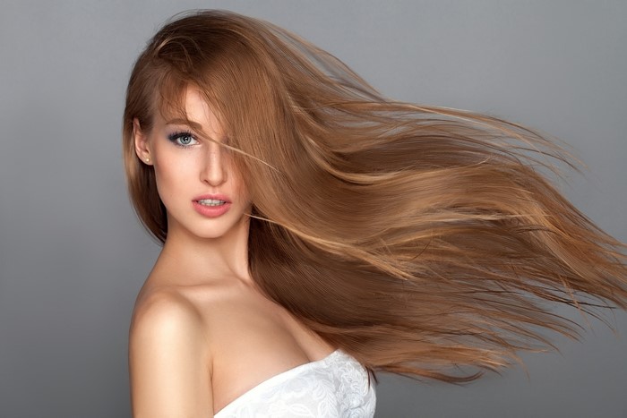Brown haired woman with hair blowing
