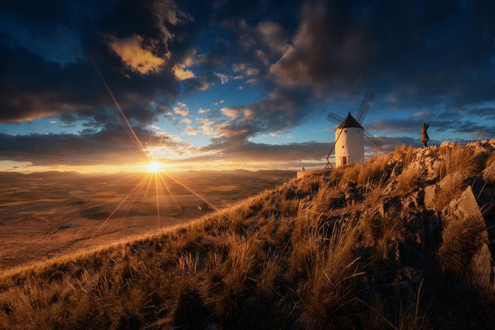 Windmill on a hill at sunset in Spain