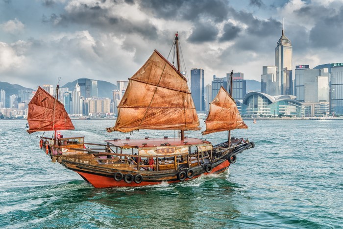 Traditional Junk Boat Sailing in Victoria Harbor Hong Kong 4K