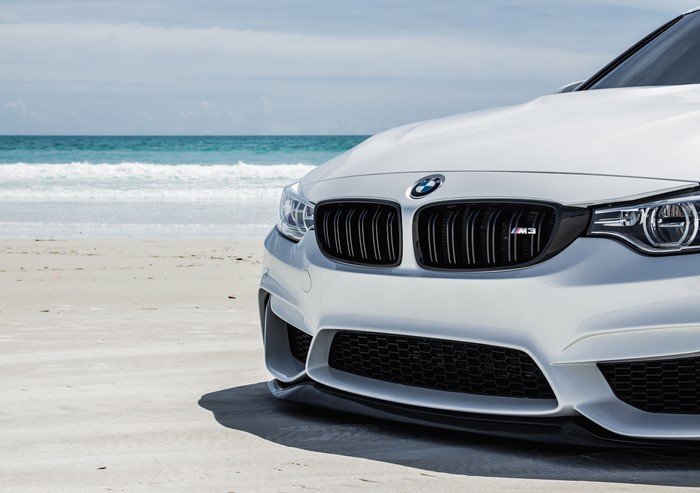 White BMW M3 on a Beach