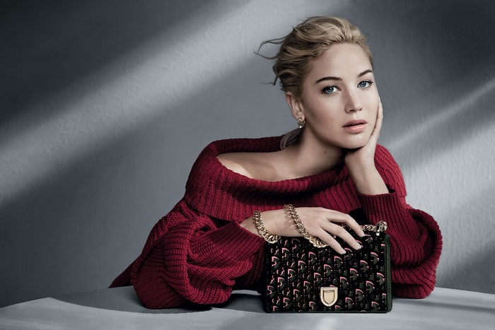 Jennifer Lawrence with Dior handbag and sweater
