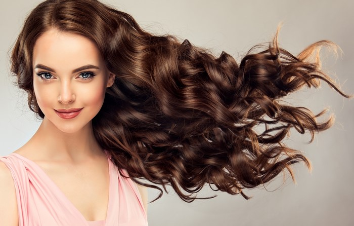 Brown haired woman with curly hair