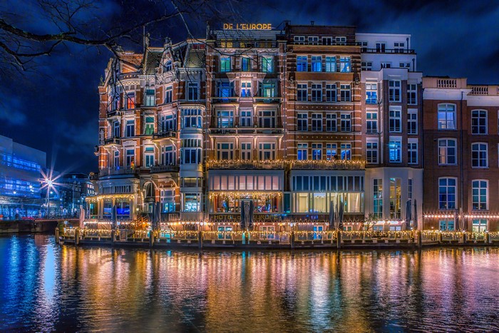 Hotel De L'Europe on a Canal in Amsterdam at Night