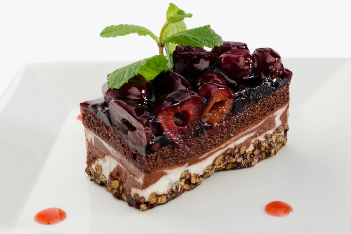 Chocolate cherry cake slice with mint