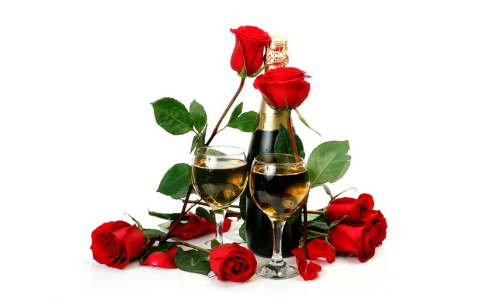Champagne bottle with roses and wine glasses