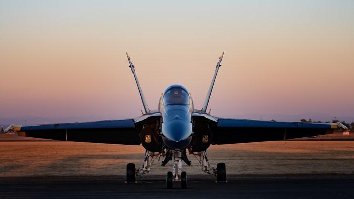 Fighter Airplane on Tarmac at Sunset