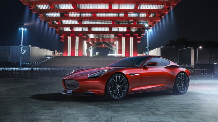Red Piech Mark Zero electric car at night
