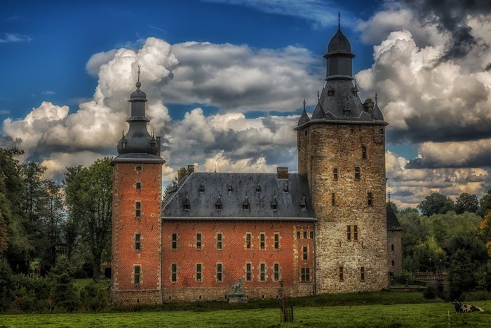 Castle Beusdael in Belgium under a cloudy sky