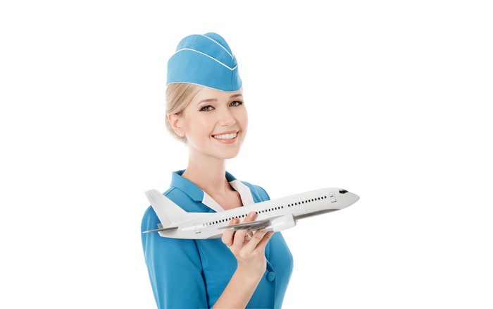Stewardess holding a model airplane