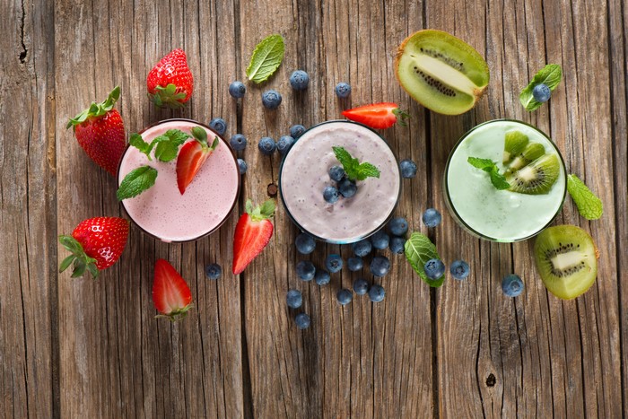Strawberry, Blueberry, and Kiwi Smoothies on Wood