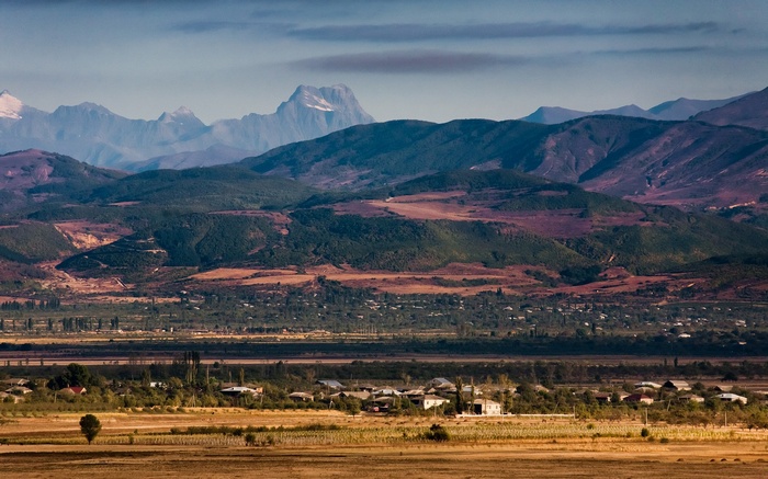 Mountain range with village in the valley