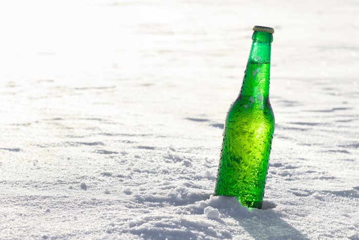 Green bottle in snow