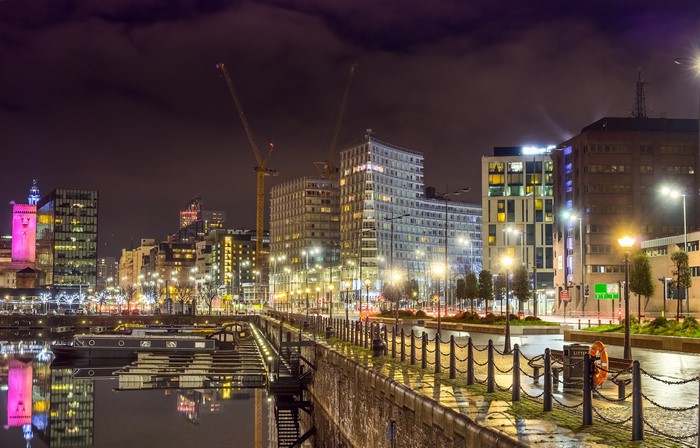 Liverpool waterfront at night with cranes