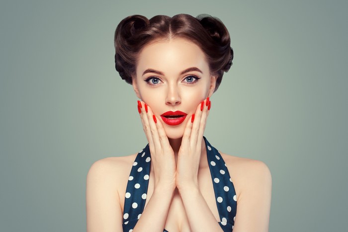 Woman with retro hairstyle and red lips