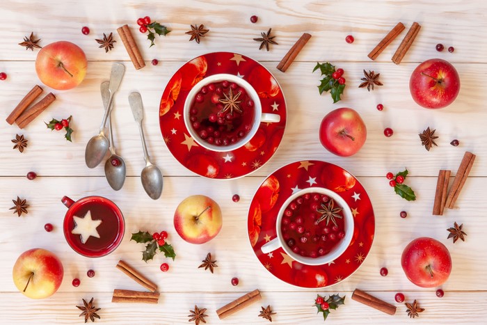 Christmas still life with apples, cinnamon, and mulled wine