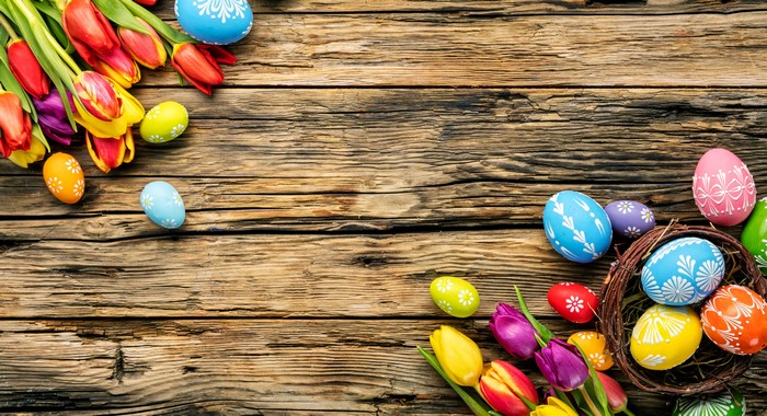 Easter Eggs and Tulips on Wood Planks