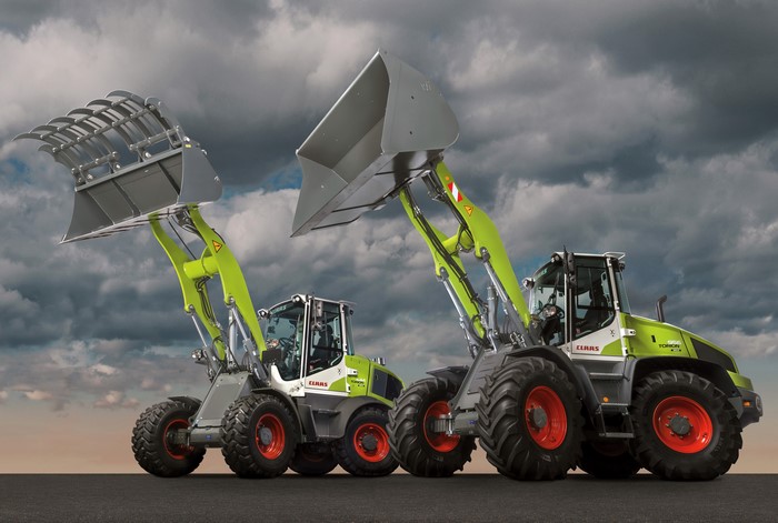 Two Claas Torion Sinus loaders with buckets raised