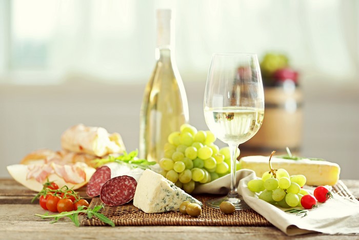 Wine, Grapes, Cheese, Sausage, and Bread Platter