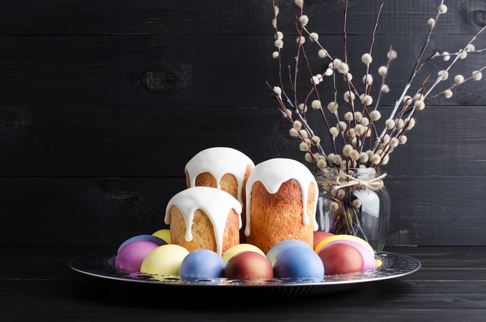 Easter Kulich cakes with icing and eggs