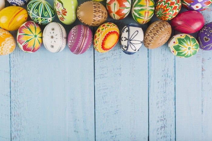 Easter eggs on blue wooden planks