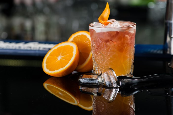 Cocktail with oranges and ice