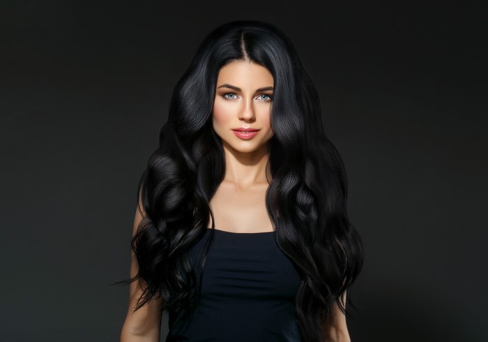Brunette woman with long wavy black hair
