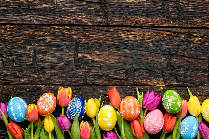Easter Eggs and Tulips on Wood Planks