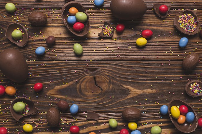 Easter Chocolate Eggs and Candies on Wood