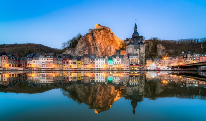 Dinant, Belgium cityscape with citadel and river reflection