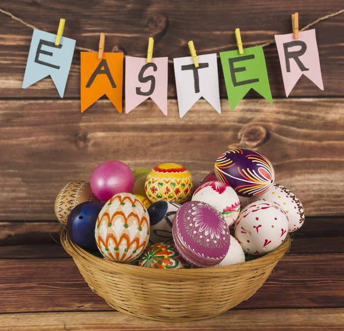 Easter eggs in a basket with banner