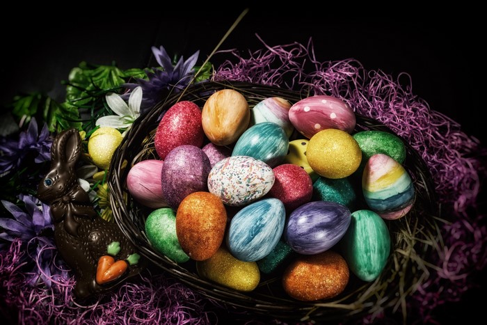 Easter basket with chocolate bunny and decorated eggs