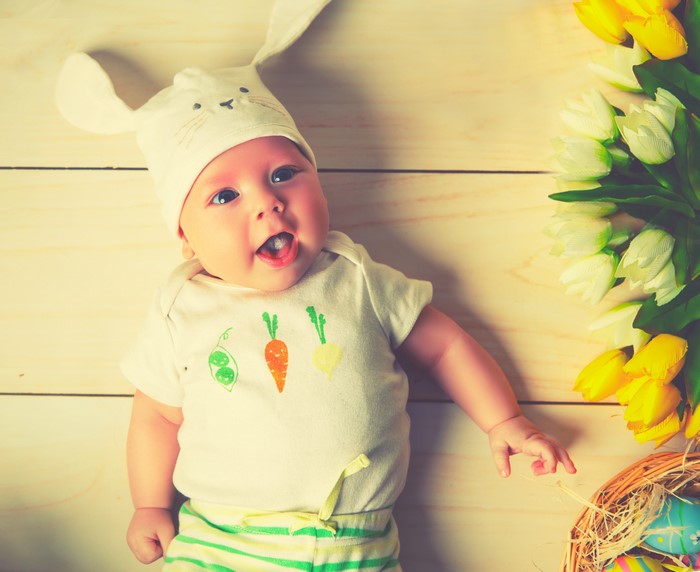 Baby in Bunny Hat with Easter Tulips and Eggs