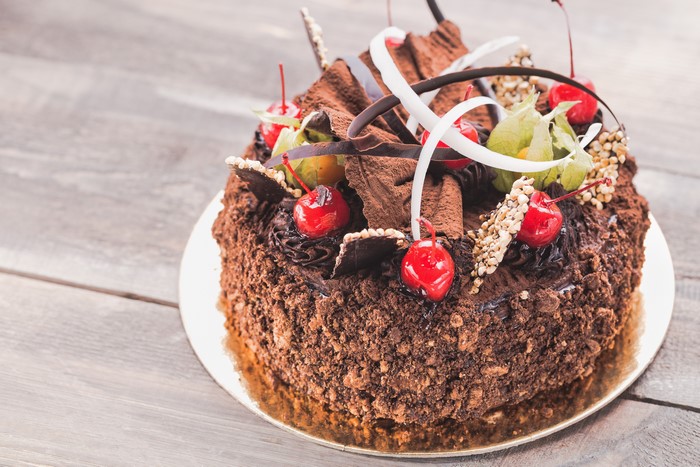 Chocolate cake with cherries and chocolate shavings