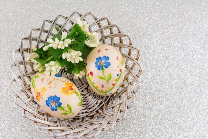 Easter Eggs in a Basket with Flowers