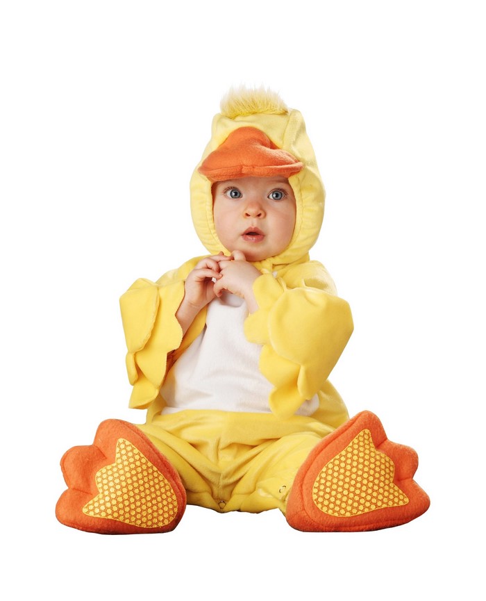 Baby in a duck costume sitting on a white background