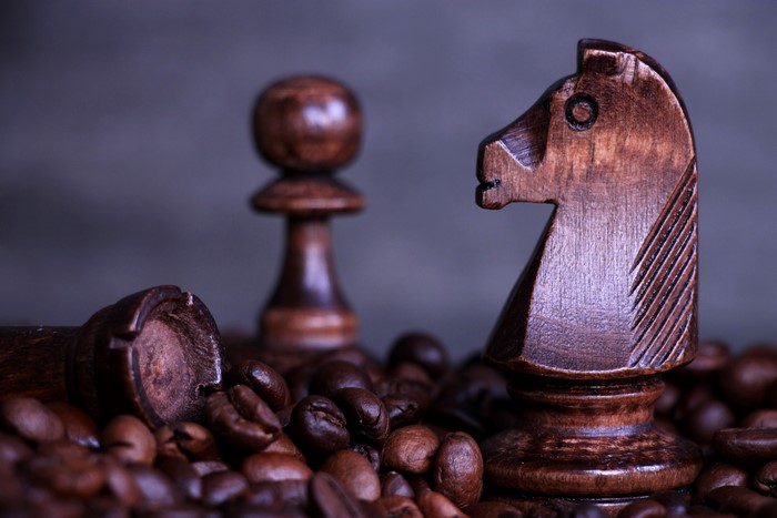 Wooden Chess Pieces and Coffee Beans