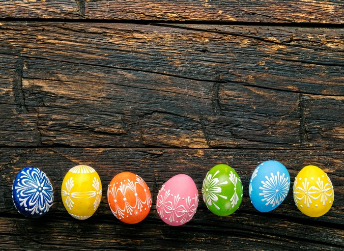 Easter eggs with designs on wood planks
