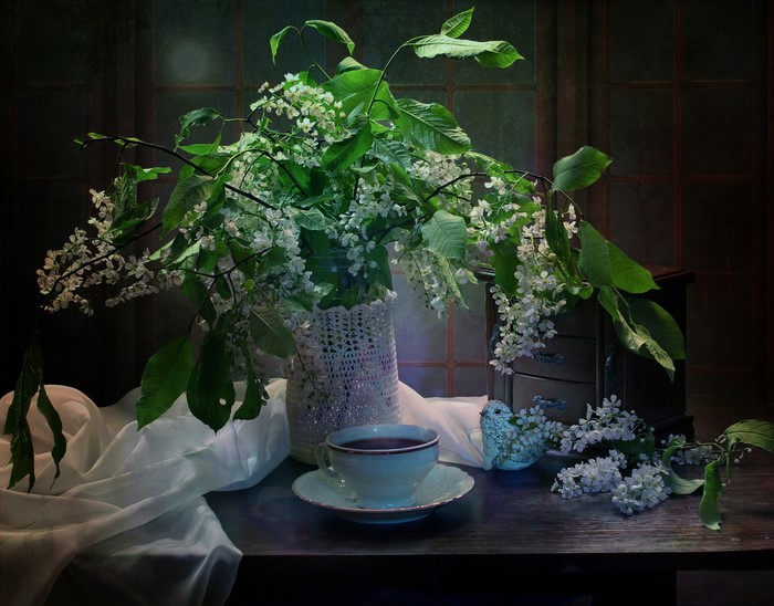 Still life with flowering branches and tea