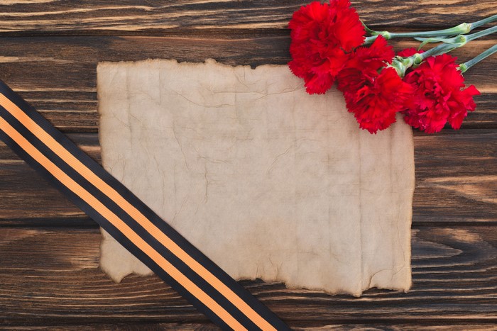 Carnations and St. George's Ribbon on Parchment