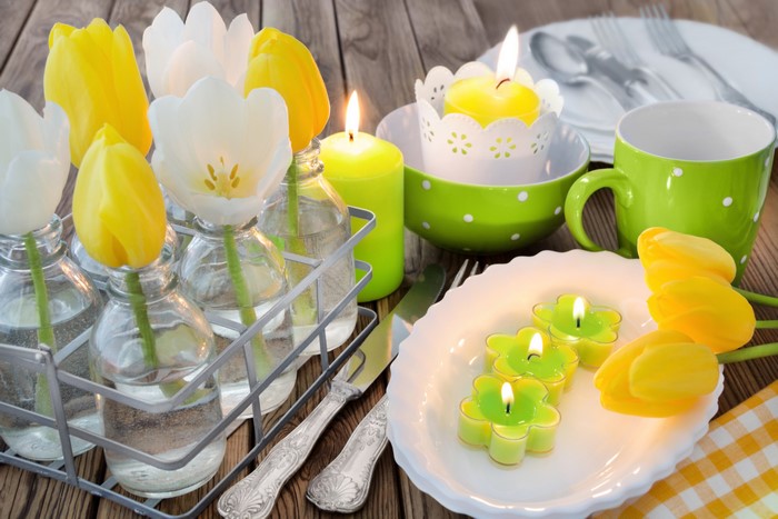 Tulips and candles on a table setting
