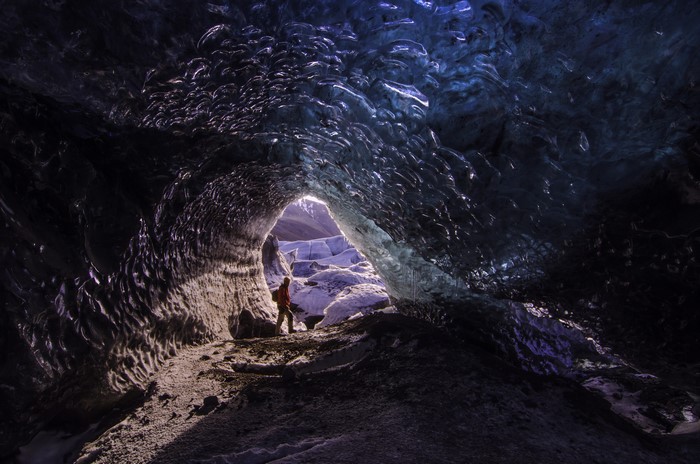 Person inside an ice cave on Vatnajokull Glacier, Iceland