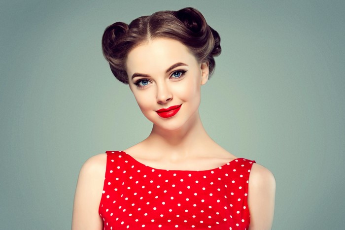 Woman with retro hairstyle and red polka dot dress
