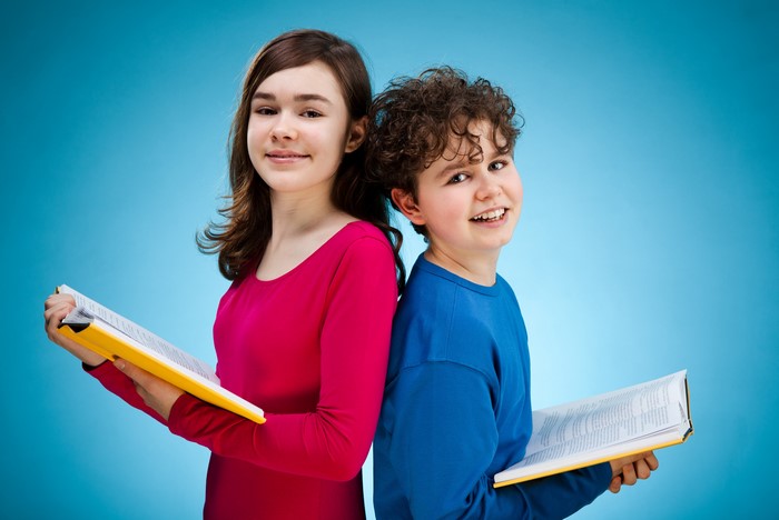 Two children reading books