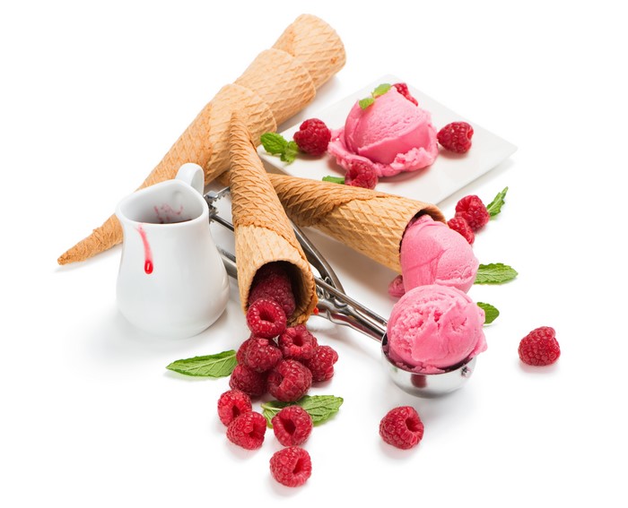 Raspberry ice cream with cones and berries