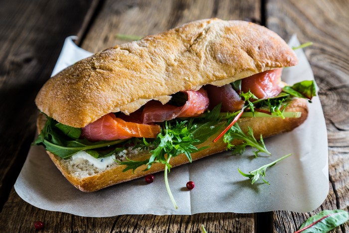 Sandwich with smoked salmon and greens