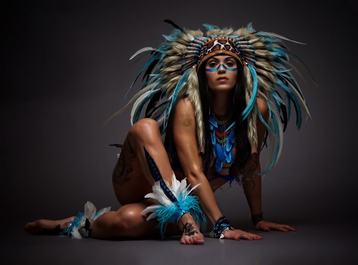 Woman Wearing Vibrant Feather War Bonnet