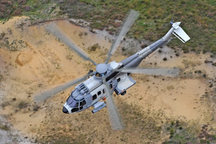 Airbus H225M helicopter in flight from above