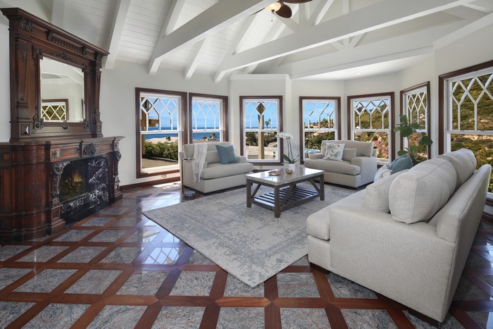 Living room with fireplace and ocean view