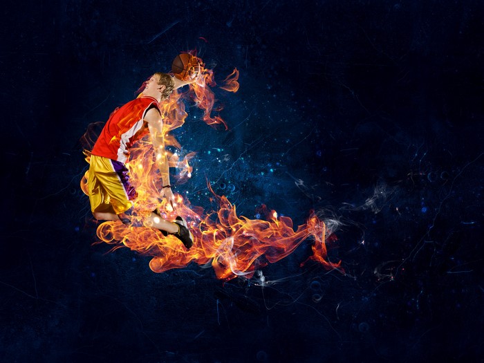 Basketball player jumping with fire