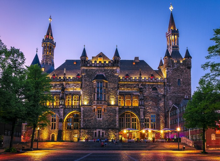Aachen Town Hall at dusk with street lights